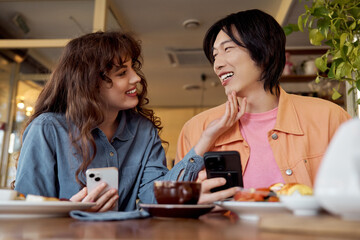 Joyful moments shared between multicultural friends in a cozy cafe