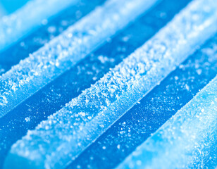 Close-up of blue crystalline structures with frost textures, showcasing abstract scientific patterns.