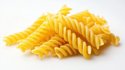 Golden Yellow Pasta Spirals on White Background
