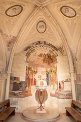 MATERA, ITALY - MARCH 8, 2022: The baptistery of the church Chiesa di San Pietro Caveoso with the frescoes by unknown artist of 16. cent.