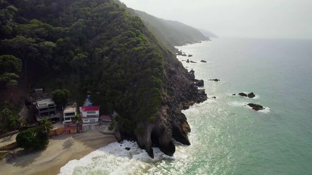 Stunning aerial view of the coastal mountains of La Guaira, near Playa Osma at sunset