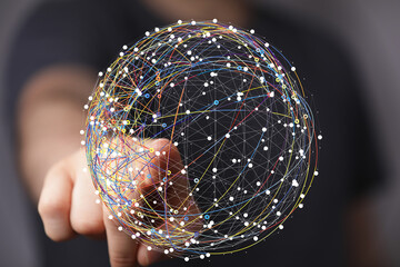 A hand interacts with a digital globe, showcasing global network connections and data flow.