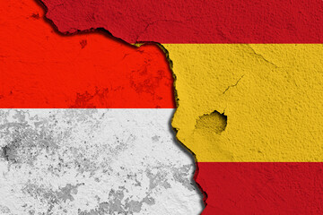Cracked Wall Featuring Combined Flags of Spain and Indonesia. Image depicting a cracked wall...