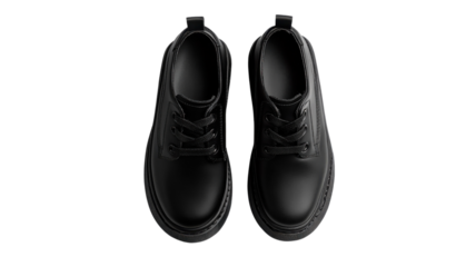 Black leather shoes are arranged neatly on a clean surface, highlighting their modern design and sturdy construction