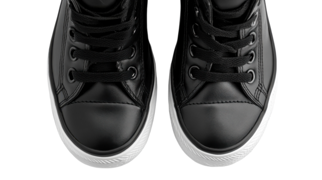 Stylish black sneakers with a sleek design and contrasting white sole are positioned symmetrically for visual appeal