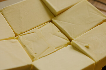 High-quality image of fresh butter cubes, perfect for baking or cooking.  Download now!