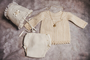 Vintage baby clothing set with bonnet, knit sweater and gold pendant