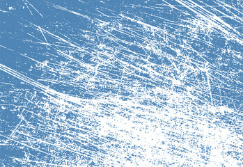 Abstract blue texture with white scratch marks for artistic backgrounds or digital design elements. a grunge effect is achieved with this rough surface.