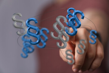 Abstract 3D rendering of legal paragraph symbols. Perfect for law, justice, and contract concepts.