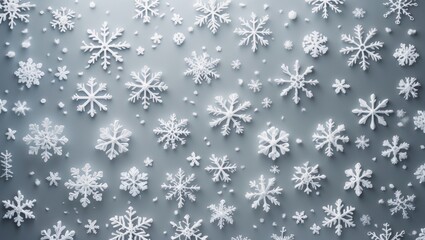 Christmas or winter composition featuring a pattern of snowflakes on a pastel gray background.