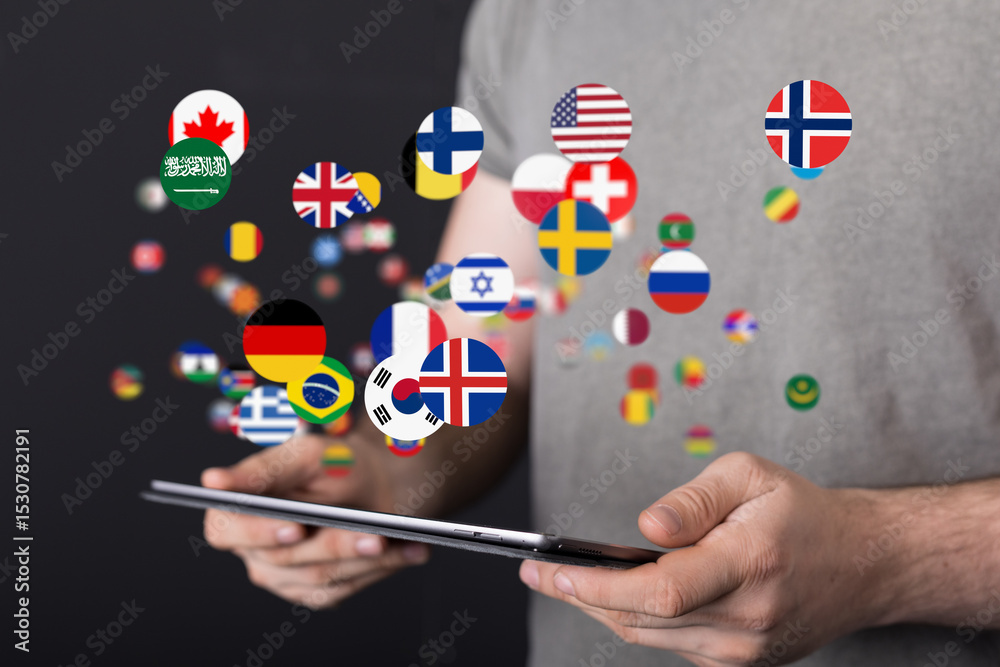 Poster image of a person holding a tablet with digital world flags. global communication concept.