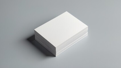 Blank business cards on a light grey background. Design mockup for presentation.
