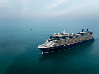 luxury cruise ship for first class passenger is sailing in green sea,