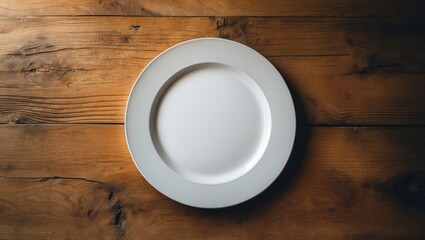 Blank white dish on a wooden background.