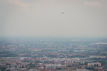 Aerial View of Bergamo Italy with Plane Flying