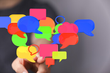 Abstract image of colorful speech bubbles, representing communication, social media, and online...