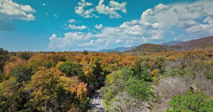 Aerial view of Dry Chandrabhaga River next to the Rishikesh Dehradun national highway, Uttarakhand. Epic Hill Chain Scenery Covered by Lush Green Jungle. The highway goes through Rajaji National Park.
