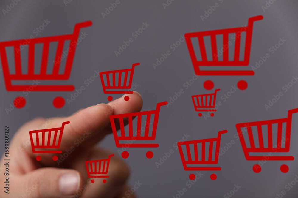 Poster image of a finger interacting with multiple digital shopping carts, symbolizing online shopping and 
