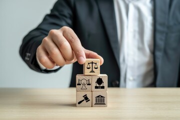 Wooden blocks with legal symbols being arranged.