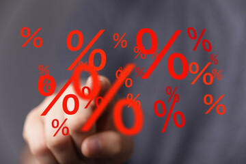 Image of hand interacting with percentage symbols, ideal for sales, discounts, finance, and...