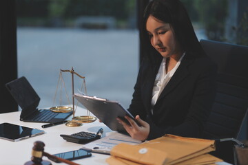Judge gavel with Justice lawyers having team meeting at law firm background. Concepts of Law and...