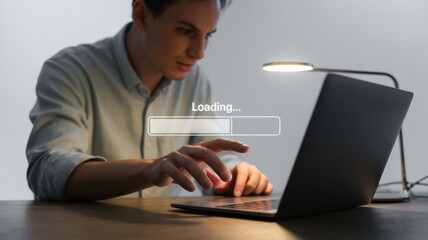 Person using a laptop computer with a loading bar displayed.
