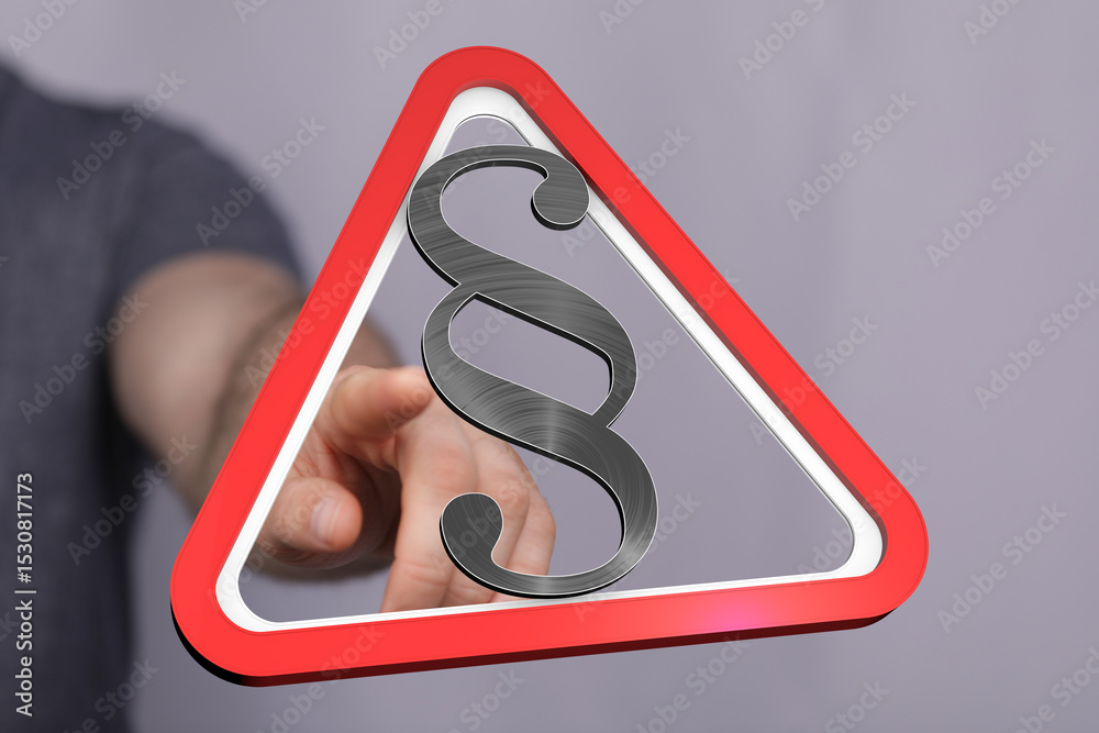 Aufkleber high-quality stock photo of a hand pointing at a legal warning sign with a paragraph symbol. ideal f