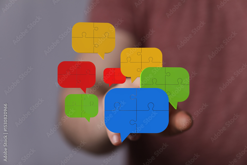 Poster colorful puzzle pieces forming speech bubbles. teamwork, communication, and problem-solving concept.