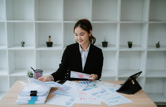 Close up businessman hand using calculator to budgeting and tax calculation monthly expenses. budget management and accounting on table. Business finance accounting banking concept.
