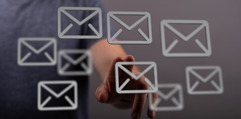 Hand interacting with email icons, digital inbox, email management, communication.