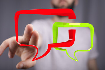 Hand interacting with 3D speech bubbles,communication, dialogue, feedback, conversation, online...