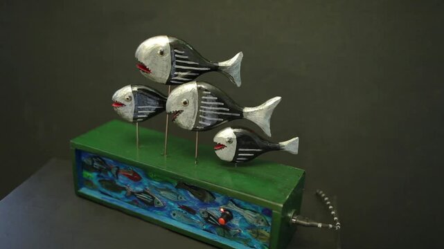 piranhas a school of toothy predatory fish swim synchronously, mechanical automanon performance, loop
