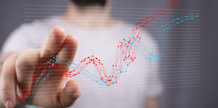 Businessman interacts with a digital graph showing growth, progress, and analytics. Perfect for reports, presentations, and technology articles.