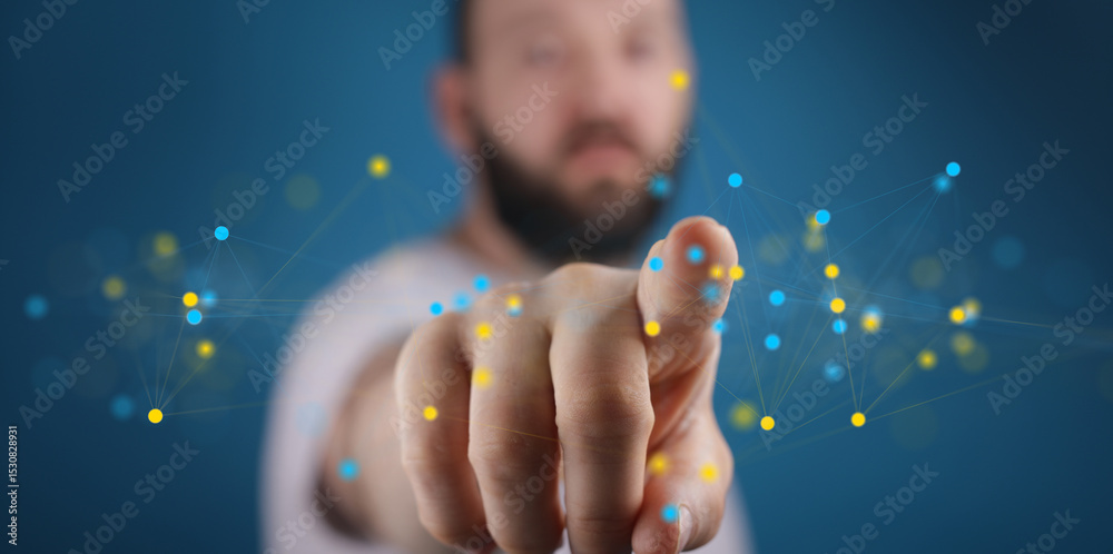 Poster close-up of a man's finger pointing at a digital network, showcasing connectivity and technology.