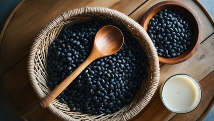 Black soy bean seeds and soy milk on wooden background, tabletop view, nutritious beverage