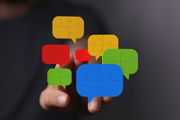 Colorful puzzle pieces forming speech bubbles,teamwork, communication, solutions.