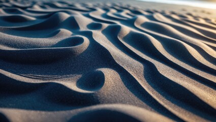 A simple flat lay of fine, dark sand featuring a smooth, rippled texture. Ideal for designing a natural and earthy background.