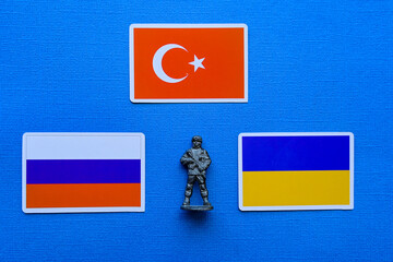 Flags of Russia, Ukraine and Turkey on a blue background. The Russian-Ukrainian conflict.
