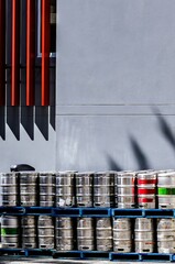 Beer kegs stored outside a hotel.
