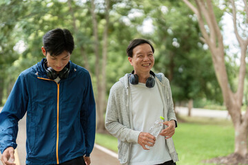 Father and Son Enjoying a Wellness Walk and Sharing Smiles