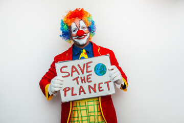 Clown holding save the planet sign