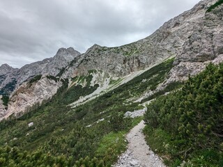 Panoramic view of Logarska dolina valley with peaks of Slovenian Alps covered by passing clouds. © Semi