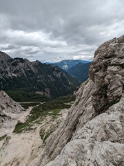Panoramic view of Logarska dolina valley with peaks of Slovenian Alps covered by passing clouds.