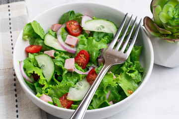 salad top with ham