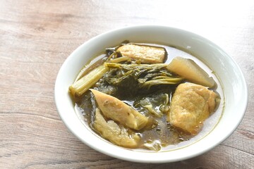 boiled braised mixed vegetable with tofu in Chinese herb stew soup on bowl 