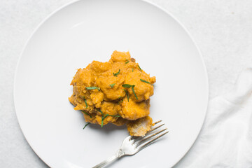 Overhead view of nigerian yam porridge, top view of nigerian asaro on a white backgroundOverhead view of nigerian yam porridge, top view of nigerian asaro on a white background