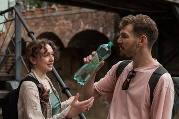 A couple explores the historic Abanotubani district in old town of Tbilisi on taxi and by foot...