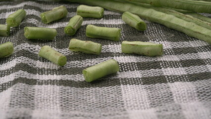 Fresh organic or French beans green peas on wooden background.Healthy food concept.