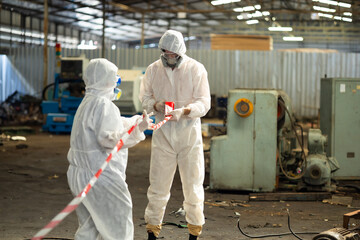 red barrier cross tape : No trespassing. man workers Officials from the Department of Hazardous...