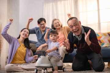 Joyful family gathering celebrating special moments at home with laughter and fun activities in the cozy living room